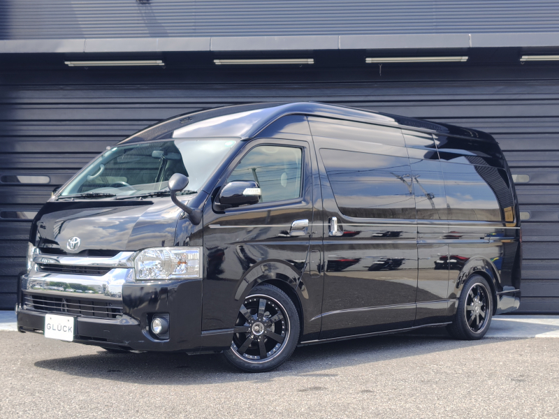 トヨタ ハイエース グランドキャビン　ファインテックツアラー ワンオーナー車 禁煙車 ロング・ハイルーフ・ワイドボディ 左パワースライドドア 2・3列目オットマン付キャプテンシート デュアルエアコン 10人乗り ナビ＆TV 社外アルミ 後部用大型モニター ローダウン